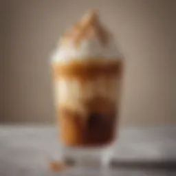 A close-up of a beautifully layered iced caramel macchiato showcasing the rich caramel and espresso contrast.