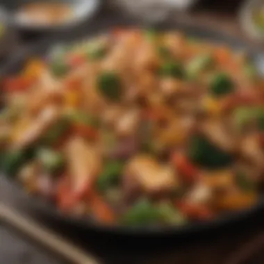 A plate of chicken stir-fry with colorful vegetables