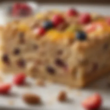 A close-up of a slice of oatmeal bake topped with fresh fruits and nuts.