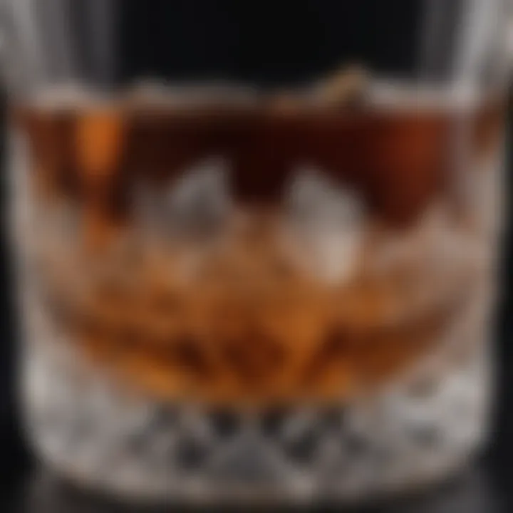 Close-up of a crystal bourbon glass with intricate detailing.