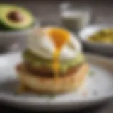 Gourmet English muffin topped with avocado and poached egg