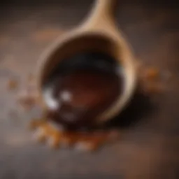 A rich, dark syrup drizzled over a wooden spoon