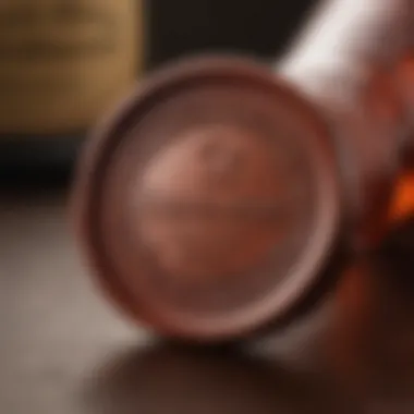 A close-up of a Makers Mark bottle showcasing its iconic wax seal