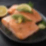 Fresh salmon fillet garnished with lemon slices and herbs