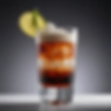 Close-up of a tall glass filled with a layered cocktail, emphasizing presentation