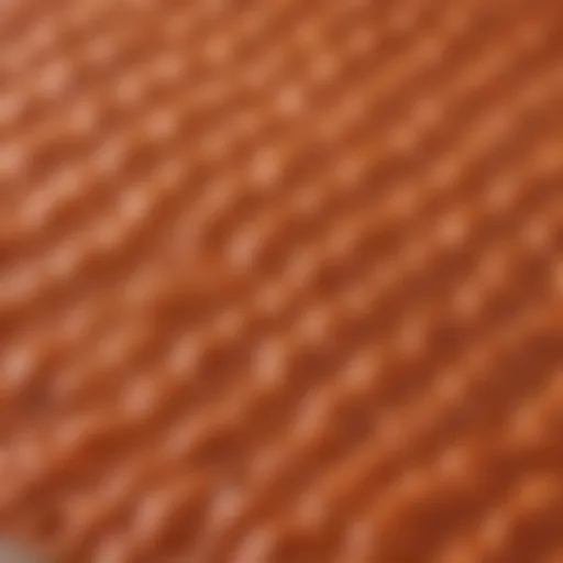 A close-up view of a 10x10 silicone baking mat showcasing its texture and flexibility