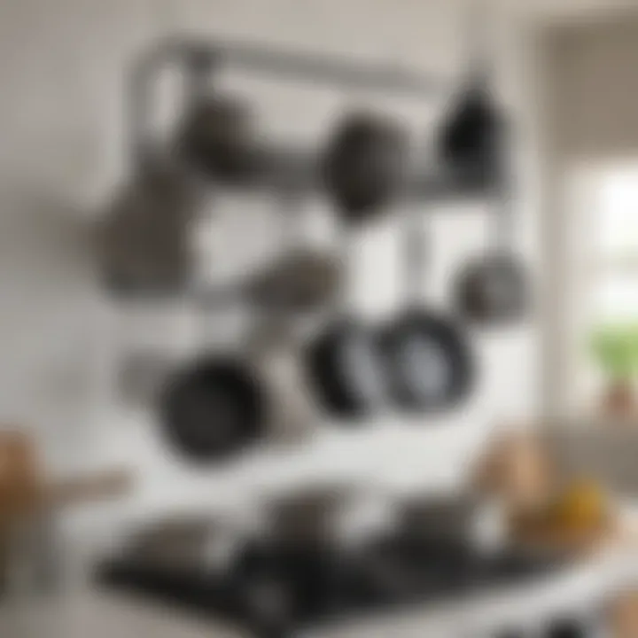 Metal pot rack displaying various pots and pans