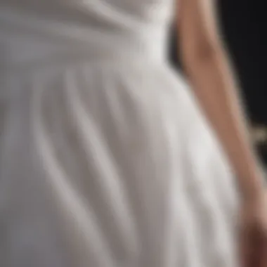 Close-up of a white dress with a visible stain