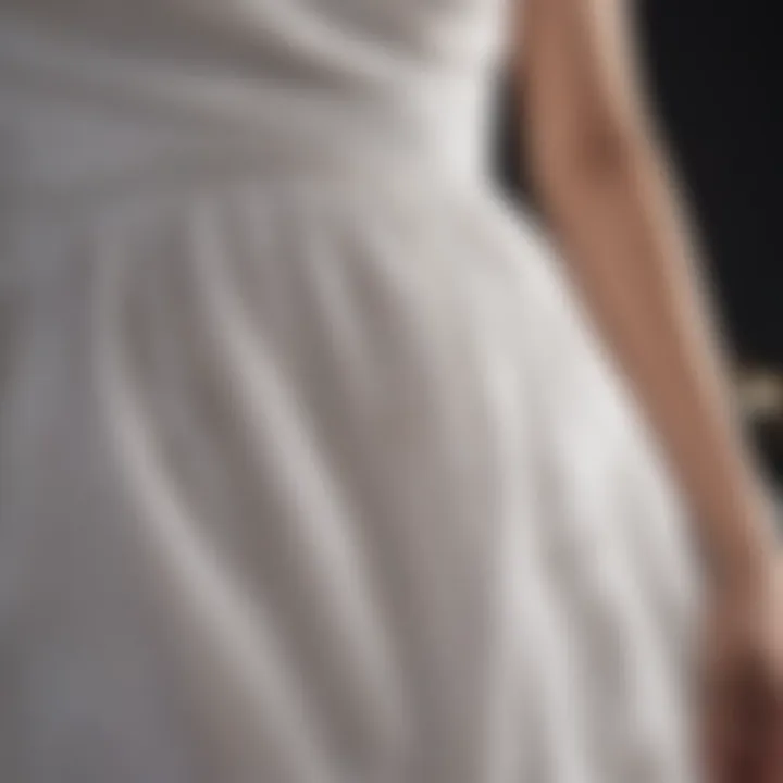 Close-up of a white dress with a visible stain