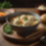 A bowl of rich chicken dumpling soup garnished with herbs
