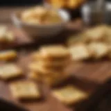 Golden-brown cheese crackers on a rustic wooden board