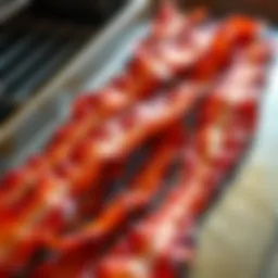 Crispy bacon strips arranged on a baking sheet