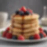 A stack of fluffy pancakes topped with fresh berries and syrup