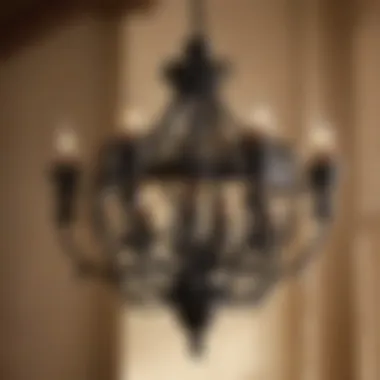 Close-up of the intricate design on a Pottery Barn black iron chandelier