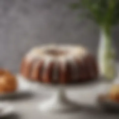 An elegant bundt cake displayed on a decorative stand, showcasing intricate design