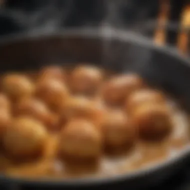 A close-up of food sizzling in hot oil, highlighting the cooking process.