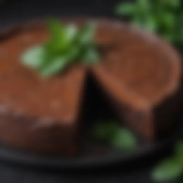 Rich flourless chocolate torte garnished with mint leaves